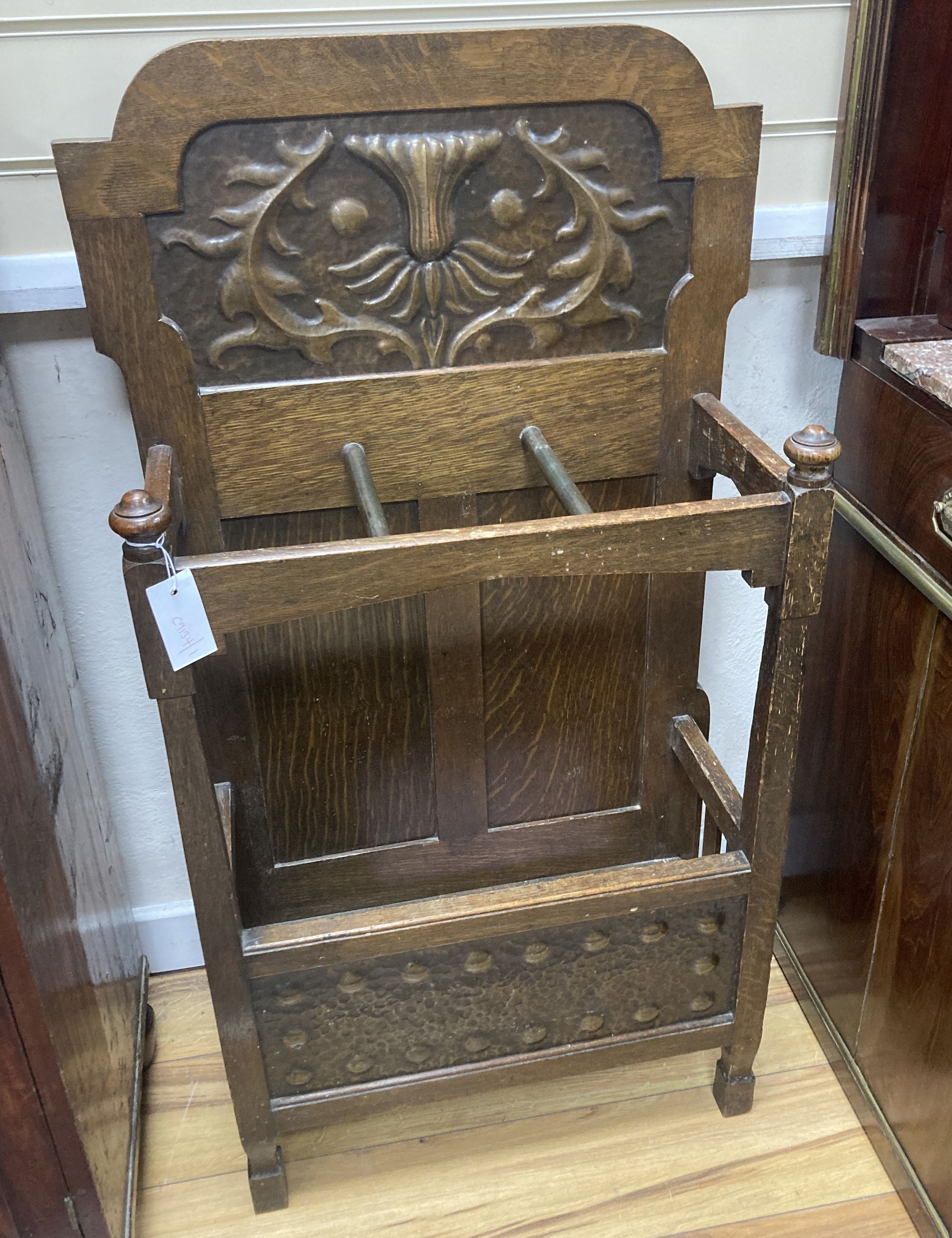 An early 20th century oak umbrella stand in the Arts & Crafts style, attributed to Shapland & Petter, width 52cm, depth 26cm, height 10